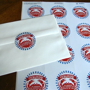 May include: A sheet of red, white, and blue crab-themed stickers with the text "You're Invited!" and the words "The Henderson's 8623 Marksdale Ave Rockville, ME 0043" printed on each sticker.