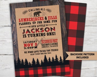 May include: A rustic brown invitation with a red and black buffalo plaid pattern border. The invitation is for a first birthday party for a boy named Jackson. The text reads "Calling all Lumberjacks & Jills, Flannel up for some fun, Our little Jackson is turning one!" The invitation includes the date, time, and location of the party. The text "We wood love to see you there!" is included with an RSVP number. The back of the invitation has a buffalo plaid pattern.