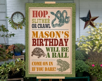 May include: A green, brown and orange birthday party sign with a snake, turtle and frog. The sign reads "Hop, Slither or Crawl Mason's Birthday Will Be A Ball Come On In If You Dare!"
