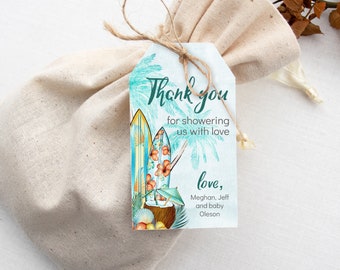 May include: A light blue thank you tag with a tropical theme. The tag features a surfboard with a floral design, a coconut with an umbrella, and palm trees. The text on the tag reads "Thank you for showering us with love, love, Meghan, Jeff and baby Oleson."