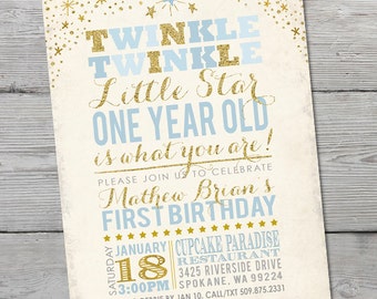 May include: A gold and blue first birthday invitation for a boy. The invitation features a star design and the text "Twinkle Twinkle Little Star One Year Old is what you are!"  The invitation also includes the child's name, Mathew Brian, and the date and time of the party. The party will be held at Cupcake Paradise Restaurant, 3425 Riverside Drive, Spokane, WA 99224. RSVP to Debbie by January 10th. Call or text 509-875-2331.