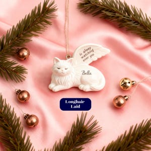 Ceramic cat ornament in light blue with minimalist cat silhouette design. Handmade personalised pet loss gift, cat memorial Christmas bauble, custom remembrance ornament, pottery memorial keepsake, sympathy decoration for loss of cat, in memory Christmas ornament, hand-painted ceramic bauble, pet memorial for families and children remembering their cats.