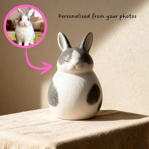 Hand-painted orange and white bunny urn for ashes, crafted from high-quality ceramic pottery. Personalized memorial urn for rabbits, blending warmth, peace, and remembrance. Inspired by playful rabbits and carrot fields, this handmade urn is perfect for rabbit lovers. Ceramic bunny ashes container, pottery keepsake for pet loss, custom rabbit memorial urn gift for bunny owners who want a unique and modern tribute.
