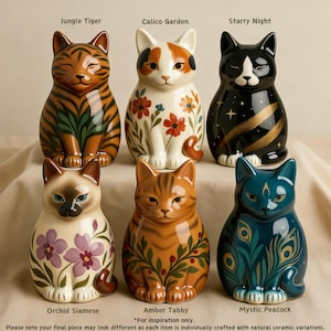 May include: Six ceramic cat figurines arranged in two rows. Top row: Jungle Tiger, Calico Garden, and Starry Night. Bottom row: Orchid Siamese, Amber Tabby, and Mystic Peacock. Each cat features unique painted patterns and colors on its surface.