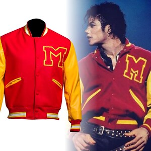 May include: A red and yellow varsity jacket with the letter "M" on the chest. The jacket has yellow sleeves and a red body, with white and yellow striped details on the cuffs and hem. The jacket is buttoned up.