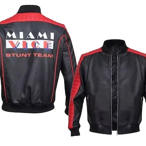 May include: Black and red bomber jacket with the text "MIAMI VICE STUNT TEAM" on the back. The jacket has a ribbed collar, cuffs, and hem. The sleeves and shoulders are red, and the body is black.