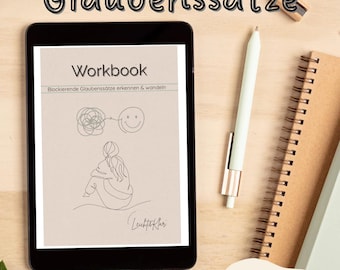 May include: A digital tablet displays a workbook titled "Workbook" with the text "Blockierende Glaubenssätze erkennen & wandeln." A pen and notebook are next to the tablet. The words "Glaubenssätze" and "erkennen und wandeln" are also visible.