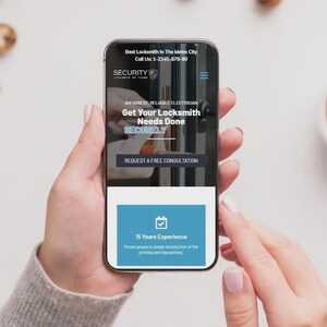 May include: A smartphone displays a locksmith service website with the text "Best Locksmith in The Metro City." The screen shows "Get Your Locksmith Needs Done" and "15 Years Experience." A cup of coffee and cookies are in the background.