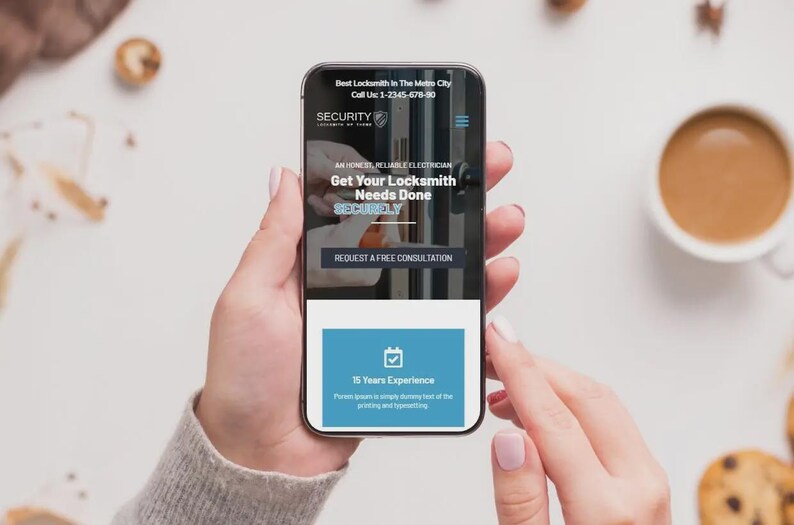 May include: A smartphone displays a locksmith service website with the text "Best Locksmith in The Metro City." The screen shows "Get Your Locksmith Needs Done" and "15 Years Experience." A cup of coffee and cookies are in the background.