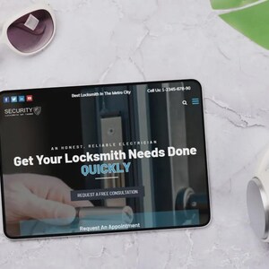 May include: A tablet displaying a locksmith service website, with the text "Get Your Locksmith Needs Done QUICKLY." White sunglasses and headphones are placed near the tablet. The website logo reads "SECURITY".