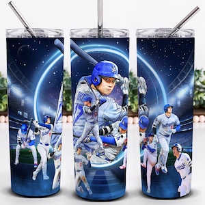 May include: Three stainless steel tumblers with a baseball theme. Each tumbler features a vibrant illustration of baseball players in action, set against a starry night sky and stadium lights. The design includes a player in a blue helmet and uniform.