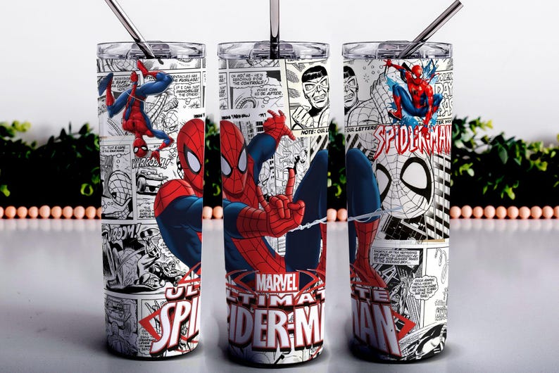 May include: Three cylindrical tumblers with metal straws, featuring a black and white comic book print background with red and blue Spider-Man illustrations. The text Marvel Ultimate Spider-Man is printed in red and white at the base of each cup.