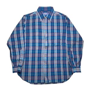 May include: Blue plaid button-down shirt with long sleeves. The shirt features a classic collar, a chest pocket, and a buttoned cuff. The plaid pattern includes shades of blue, red, and white.
