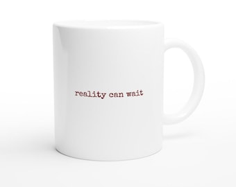 Taza de cerámica blanca de 325 ml para amantes de la lectura "La realidad puede esperar"