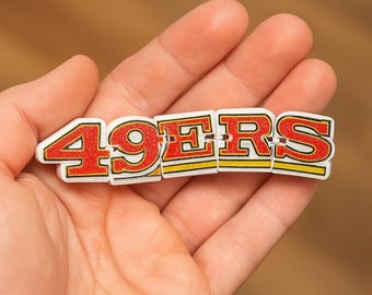 Juguete articulado flexible impreso en 3D de los San Francisco 49ers