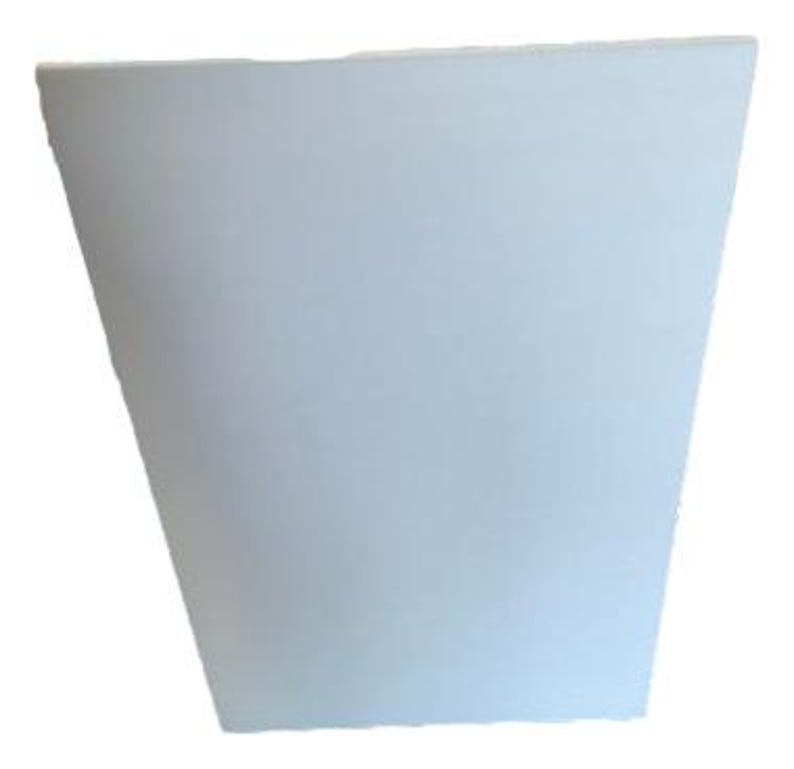 May include: A white, trapezoidal planter with a smooth surface. The planter has a slightly flared shape, wider at the top and narrower at the base. It is designed for indoor or outdoor use.