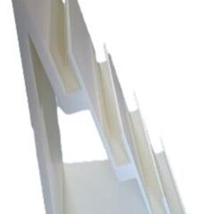 May include: A white, angled display stand with multiple tiered shelves. The stand has a clean, modern design, suitable for showcasing items. The shelves are slightly angled, providing visibility for displayed products.