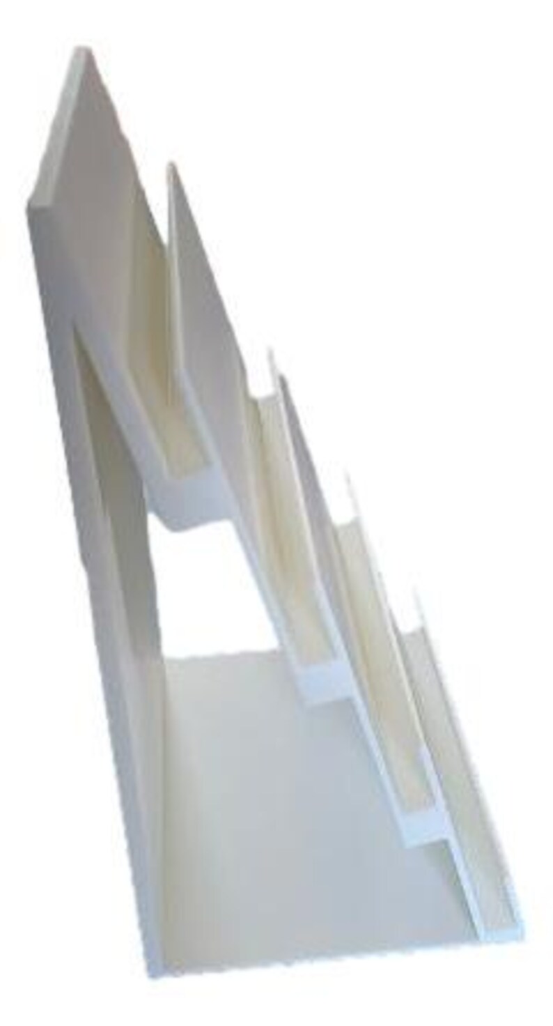 May include: A white, angled display stand with multiple tiered shelves. The stand has a clean, modern design, suitable for showcasing items. The shelves are slightly angled, providing visibility for displayed products.