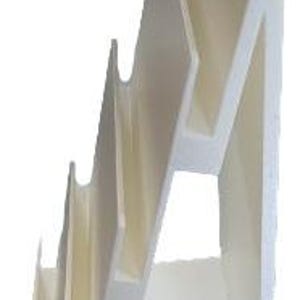 May include: A white, stepped display stand with five angled shelves. The stand has a zig-zag design, with each shelf slightly recessed. The structure is made of a solid, opaque material, and is suitable for displaying various items.