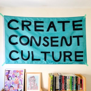 May include: A teal blue banner with the text "CREATE CONSENT CULTURE" in black lettering.