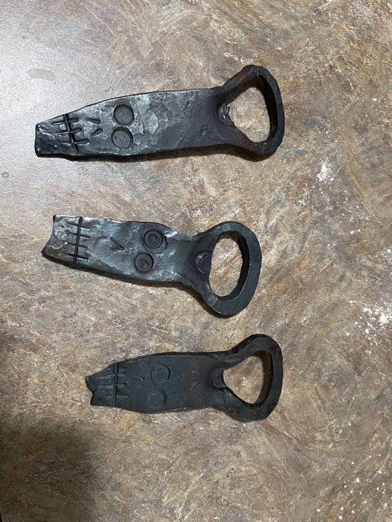 A real blacksmith hammered this skull out of steel — the kind of bottle opener that sits on your bar and starts conversations, not just pops caps.