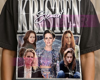 May include: Dark grey t-shirt with a graphic of Kristen Stewart, the name "KRISTEN Stewart" in a silver, vintage font. The graphic includes multiple images of the actress. The shirt has a worn, vintage appearance.