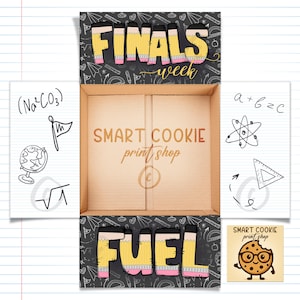 May include: A cardboard box with the words "FINALS week" and "FUEL" in yellow pencil-style lettering with pink accents. The box also features the text "SMART COOKIE print shop" and doodles of math and science symbols.