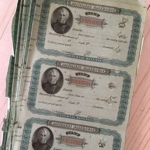 May include: A stack of vintage distillery warehouse documents. Each document features a portrait, the text "DISTILLERY WAREHOUSE", and the text "INTERNAL REVENUE". The documents are printed in black and blue ink on aged paper.
