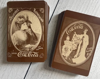 Vintage reprint Coca-Cola Playing Cards featuring their antique ads. Set of 4 cards