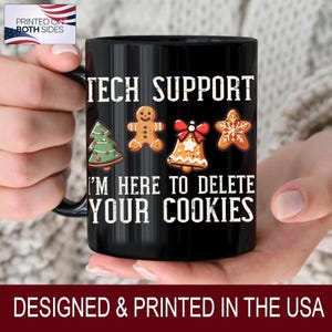 May include: Black ceramic mug with the text "TECH SUPPORT" and "I'M HERE TO DELETE YOUR COOKIES" in white. The mug features festive cookie designs: a Christmas tree, gingerbread man, bell, and star. The mug is designed and printed in the USA.