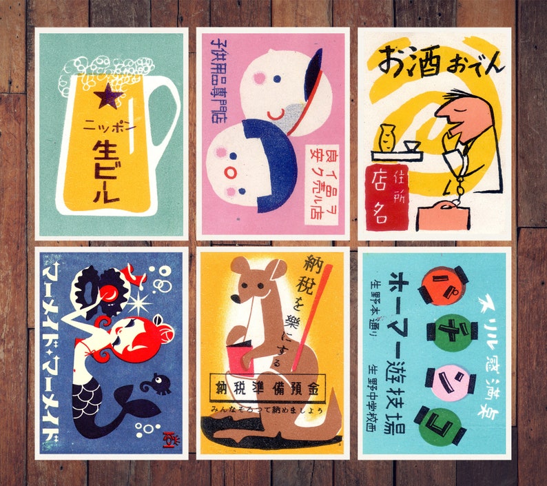 May include: Nine vintage matchbox labels with colorful illustrations. The labels feature a beer bottle, a kangaroo, a mermaid, a man drinking sake, a woman with a baby, and a variety of other designs. The labels are printed in Japanese and English.