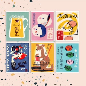 May include: Six vintage matchbox labels with colorful illustrations. The labels feature a beer glass, two children, a man drinking sake, a mermaid, a kangaroo, and a game of pachinko.