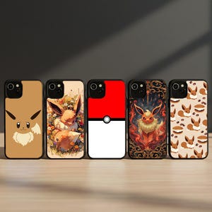 May include: Five phone cases with Eevee designs. The cases feature various art styles, including a cartoon Eevee, Eevee in a floral setting, a Pokeball design, an ornate Eevee illustration, and an Eevee pattern with coffee beans.
