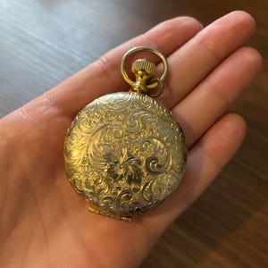 Vintage 1970s Estée Lauder Compact (pocket watch style) w/ original puff, mirror, and powder
