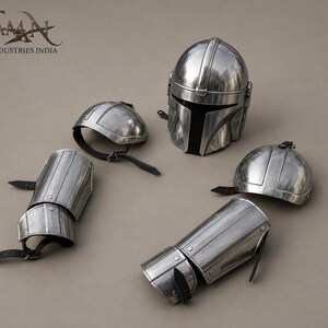 May include: A set of polished metal armor pieces, including a helmet, two shoulder caps, and two arm guards. The helmet has a T-shaped visor. The armor is silver in color and appears to be new.
