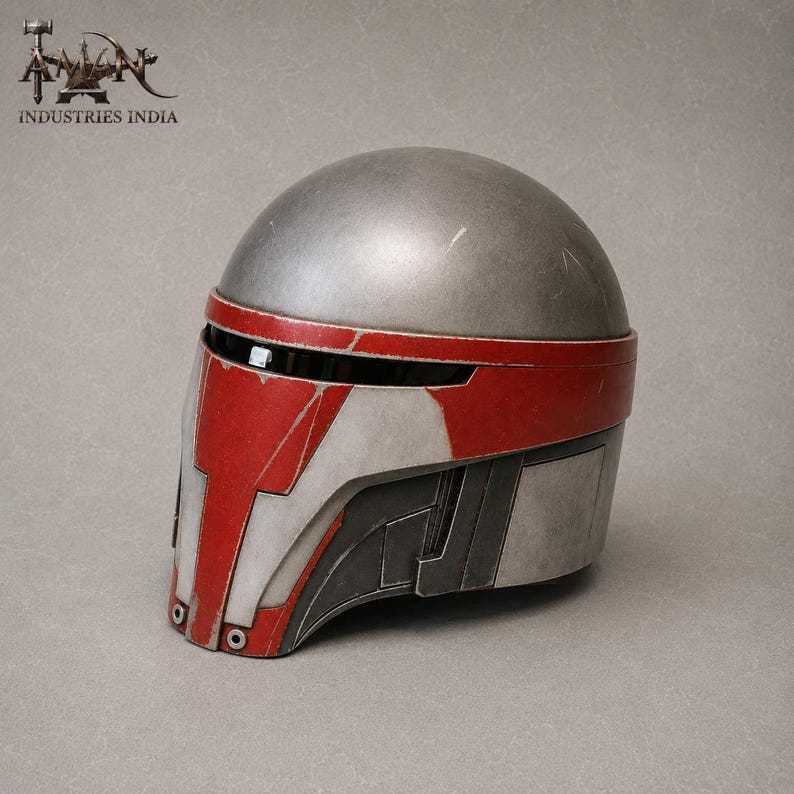 May include: A silver and red helmet with a visor. The helmet has a rounded top and angular features on the face and sides. The red accents are on the forehead and face. The helmet is likely for cosplay or costume use.