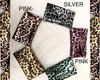Cheetah print coin purse in genuine metallic leather with 3 pockets, zipper + flap. Fits credit cards, coins, bills. Leopard print wallet.