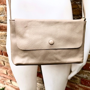 Small leather bag in dark beige. Genuine leather crossbody / shoulder bag. Light brown leather bag with adjustable strap,  zipper and flap.