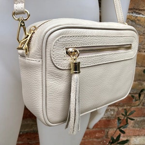 Small leather bag in CREAM BEIGE. Cross body bag, shoulder bag in GENUINE leather. Beige bag with adjustable strap and zippers. Gold accents