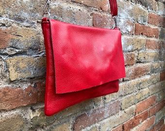 RED genuine leather bag. Cross body bag or shoulder bag in grain leather.Adjustable strap, zipper and flap.Hardware in BRONZE. Red purse