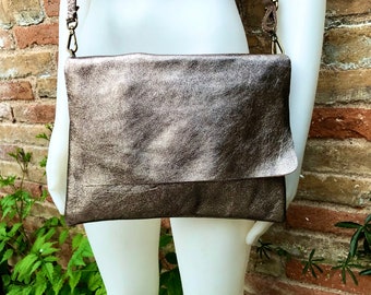 Genuine leather bag in BRONZE. Cross body bag or shoulder bag in metallic shine leather. Adjustable strap, zipper and flap. Dark gold purse