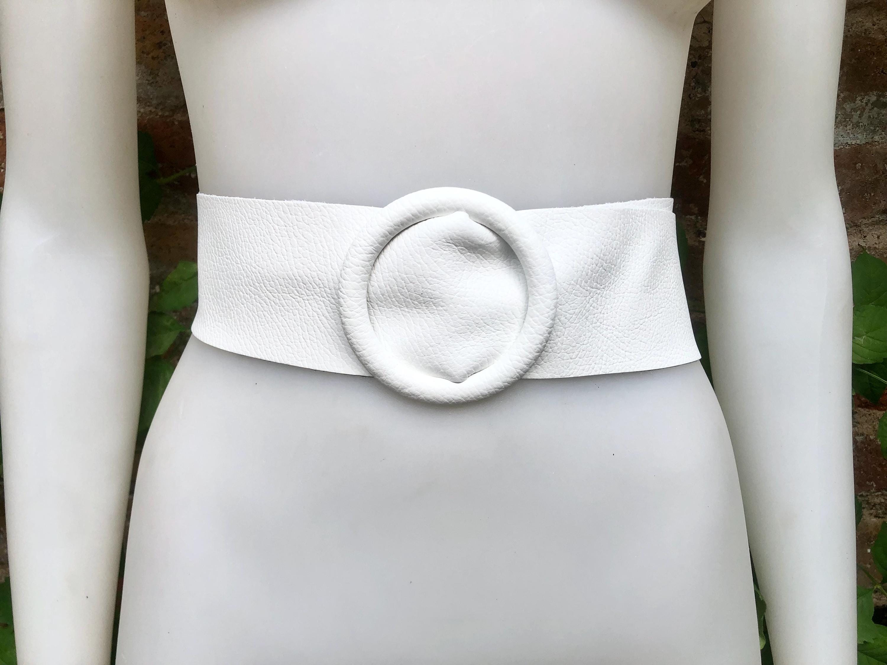 White leather waist belt with large round buckle. Soft leather