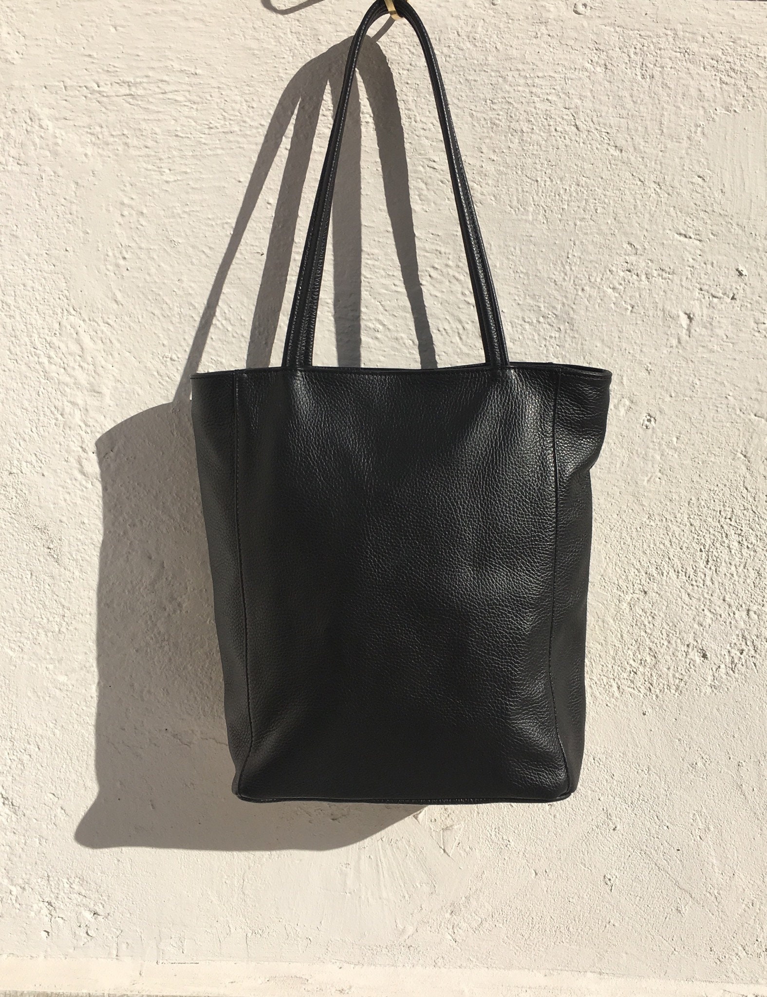 NEW with zipper and lining. Tote leather bag in BLACK . Soft GENUINE