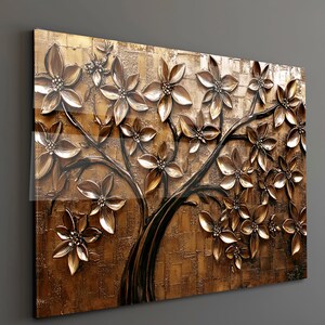 May include: A rectangular wall art piece featuring a stylized tree with dimensional bronze-colored flowers. The artwork has a textured, golden-brown background and a glossy finish, creating a 3D effect. The tree's branches and trunk are dark brown.