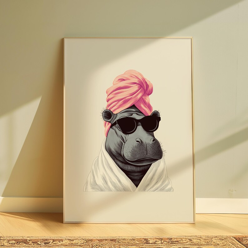 May include: A framed art print featuring a stylized hippo wearing black sunglasses, a pink turban, and a white robe. The hippo is depicted in a relaxed pose, suggesting a spa or relaxation theme. The artwork is set against a neutral background.