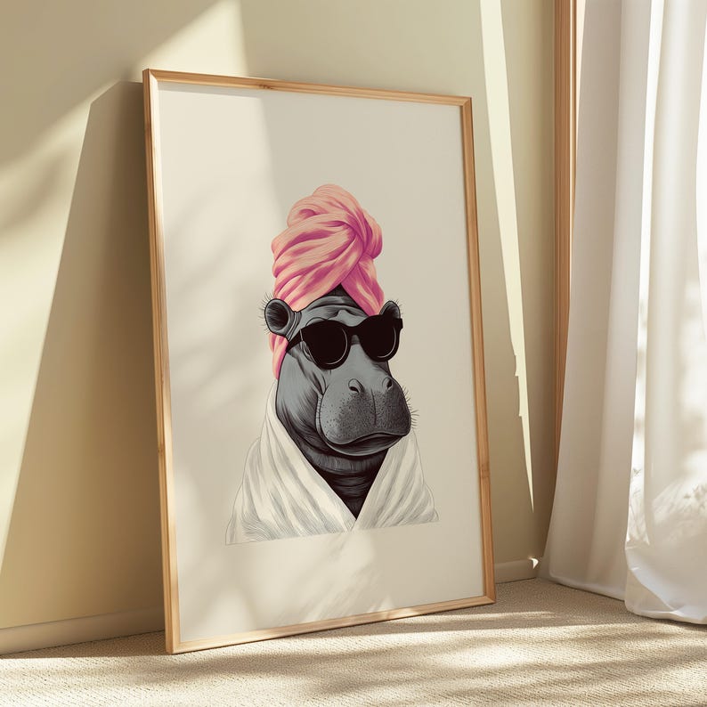 May include: A framed art print featuring a hippo wearing sunglasses, a pink turban, and a white robe. The hippo is depicted in a relaxed pose, suggesting a spa or relaxation theme. The artwork is set against a neutral background.