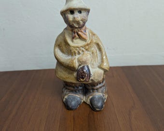 Vintage Tremar pottery figure Rural country figure holding a bottle.