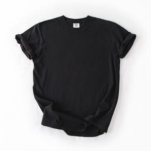 A black t-shirt is displayed on a white background.