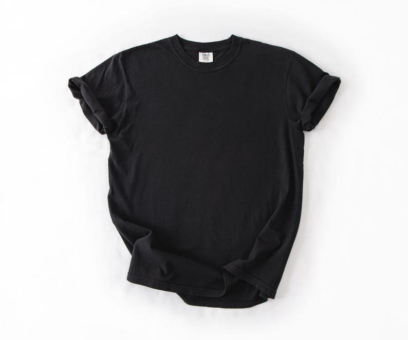 A black t-shirt is displayed on a white background.