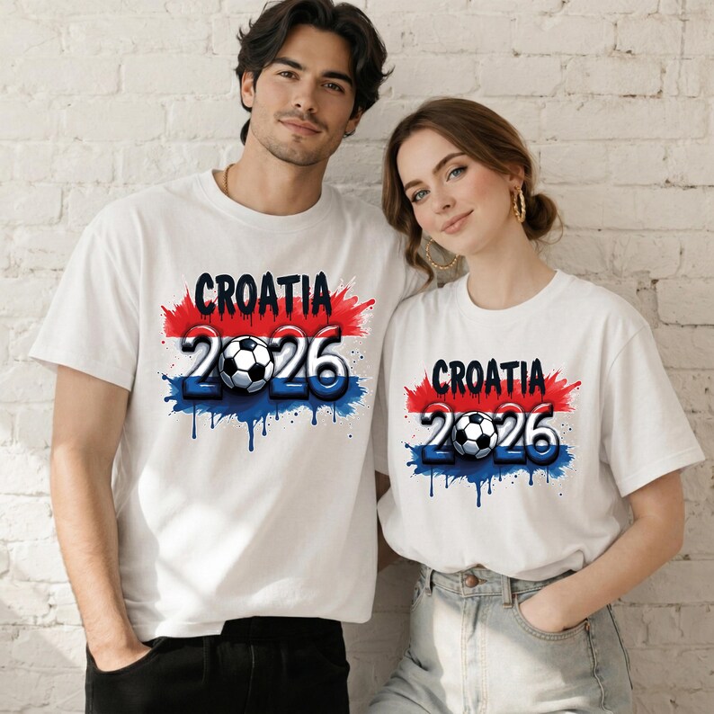 May include: White t-shirts with a Croatia 2026 design. The design features the word "Croatia" in black, with red and blue paint splatters, a soccer ball, and the number "2026" in blue.